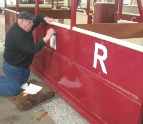 image - Volunteer refurbishing a manrider