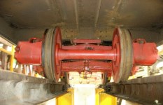 Image:- Photo of underneath of carriage, sitting on a bogie